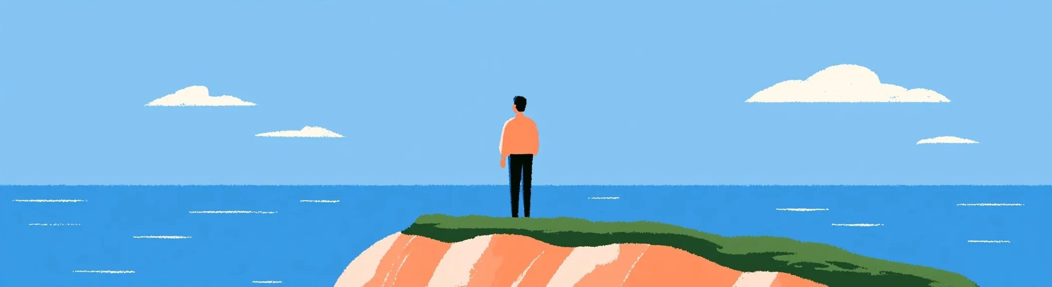A person on a cliff looking out to sea